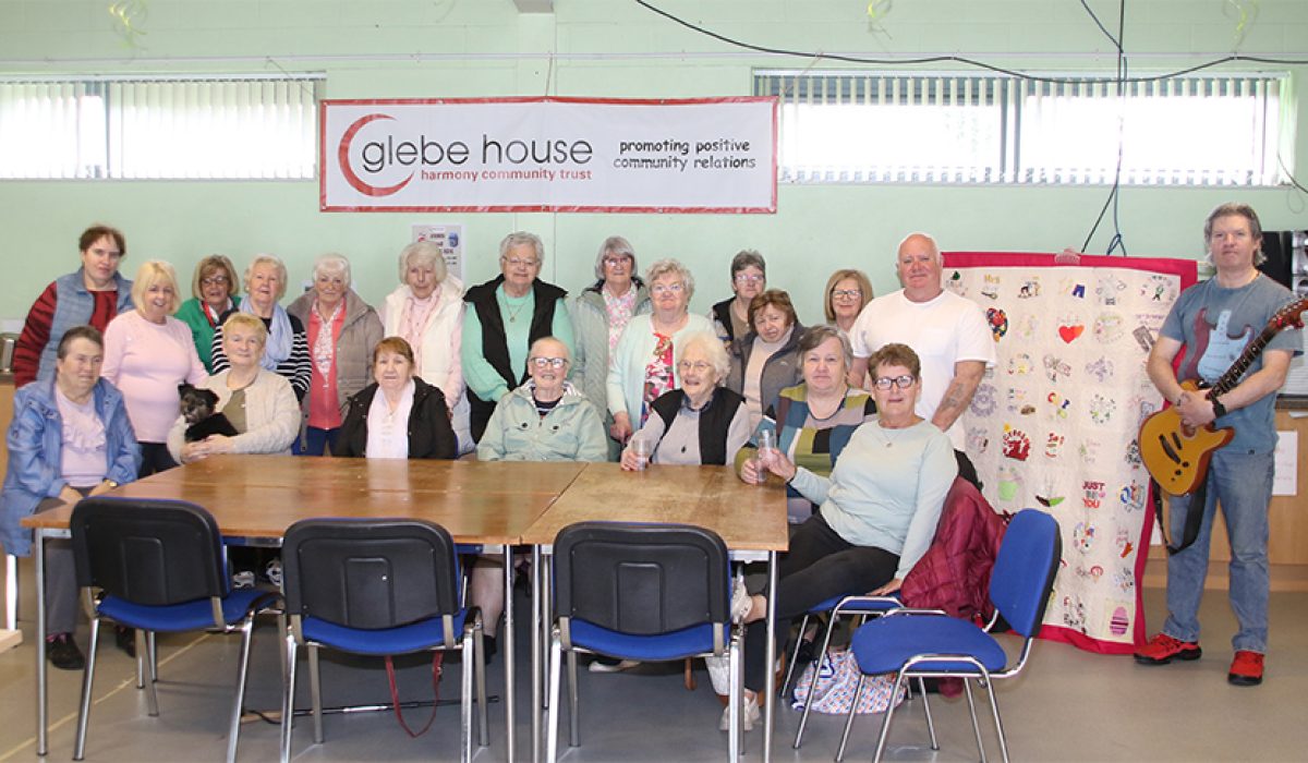 Pictured are women from across COunty Down who made a tapestry celebrating their diversity of culture and language. A celebrating launch took place in Glebe House near KIlclief. Included are Glebe Hiouse Development Officer Colin McKinty and musician Gerry Walsh who provided the entertainment for the afternoon.